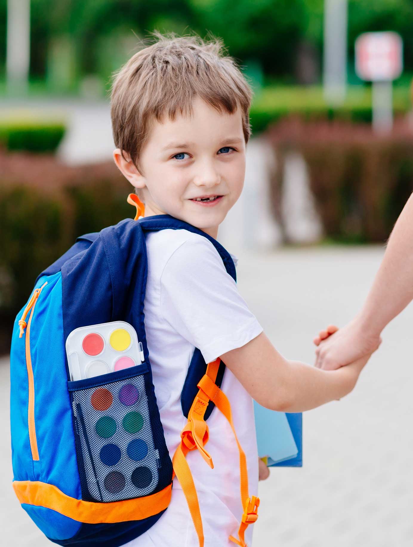 young boy wearing a backpack