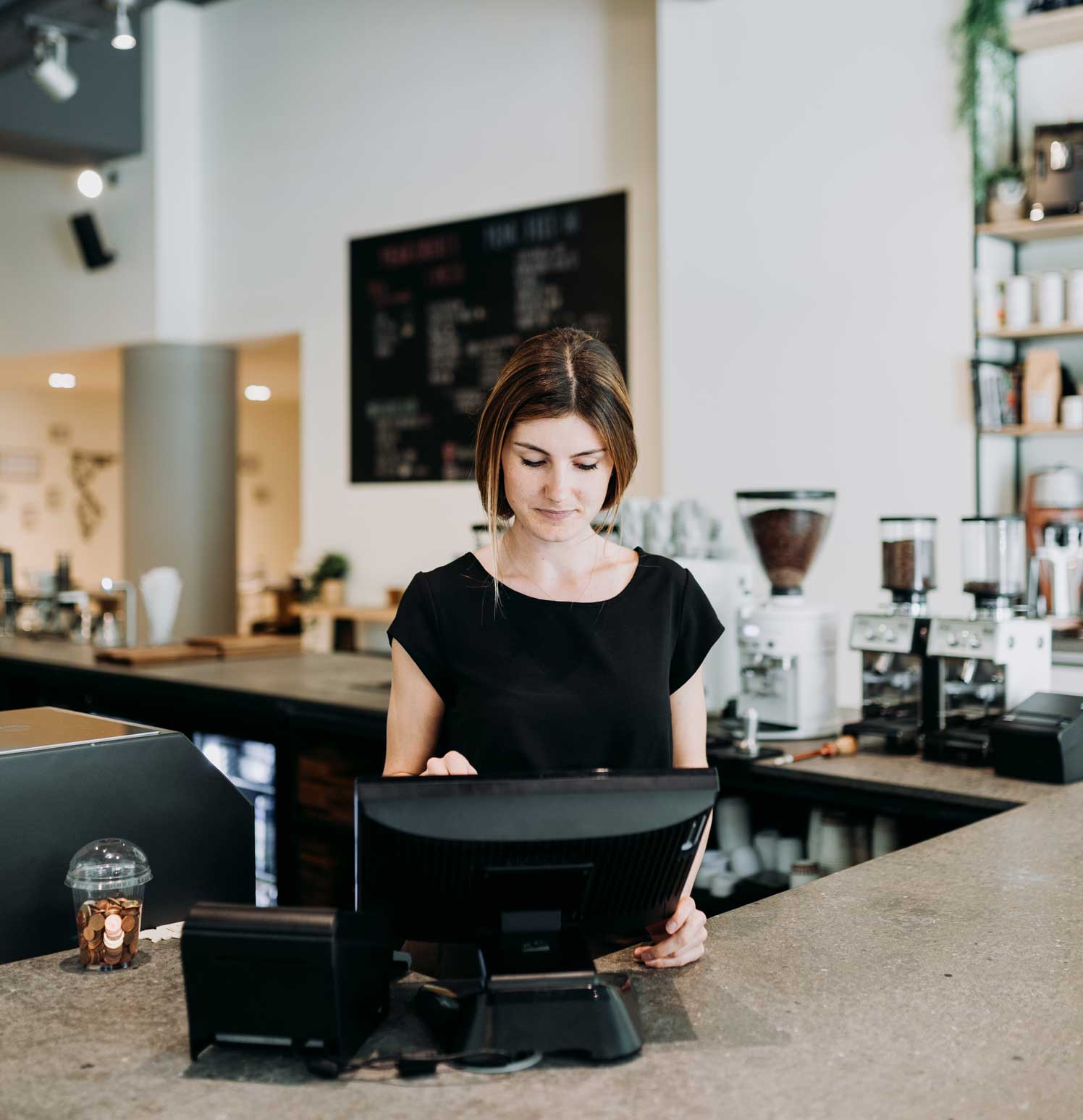 young woman working at coffee bar